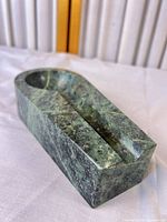 Oblique view showing overall shape and finish of marble ashtray
