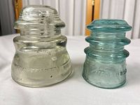 Both insulators side by side showing overall form and color