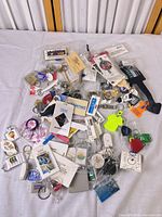 Full spread of assorted keychains showing variety and quantity