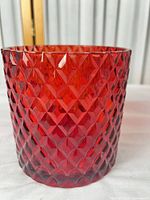 front view of red pressed glass vase showing diamond pattern