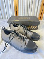 Pair of Woobies MOD-1 Cement shoes with box visible