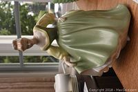 Front view of the Royal Doulton Fair Lady porcelain figurine in green dress showing the figure's facial details and dress design.