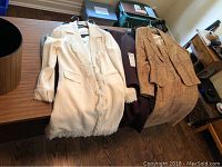 Four women’s jackets displayed on tabletop