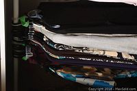 View of multiple garments on hangers