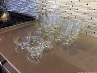 All 22 crystal glasses grouped on countertop