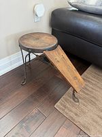 Overall view of shoe shine stand showing seat, footrest and legs