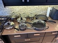 All cookware pieces arranged on countertop for overview