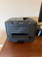 Front view of Canon MAXIFY MB2720 printer, output tray extended