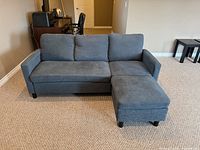 Front view sofa with ottoman forming chaise