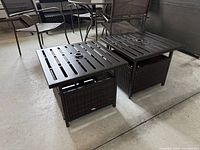 Two square Patiojoy side tables showing slatted tops and umbrella holes