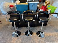 Front view of all three bar stools showing design and condition