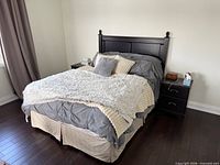 Full bed setup showing dark brown queen headboard attached