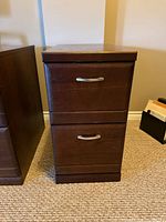 Front view of cabinet showing both drawers and handles