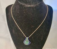 Necklace on bust showing pendant and chain