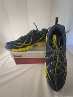 Side view of both shoes on box