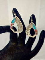 Front view of teardrop Kokopelli inlay earrings