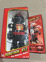 Robot in original box with flap showing features