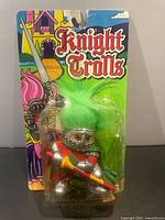 Front view of sealed Knight Trolls figure on illustrated card