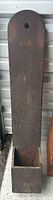 Full view of tall wooden salt box showing backboard, rounded top and storage bin