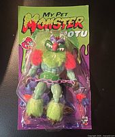 Front view of sealed My Pet Monster Moto figure on blister card