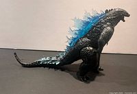 Left side view showing entire figure and tail