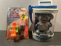 Front view showing both packaged robots