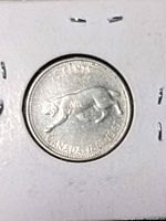 Reverse of 1967 25-cent coin with bobcat design