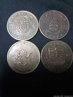 Front view of four 1967 provincial commemorative coins Ontario, Quebec, Nova Scotia, Alberta