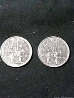 Both 1973 Canadian quarters reverse side showing RCMP rider design
