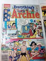 Comic book front cover in sleeve featuring teen characters in a messy room and beach scene