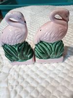 front view of flamingo salt & pepper shakers showing colour and style
