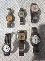 All six watches laid out front view