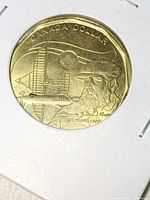 Reverse side showing commemorative design, inscriptions CANADA DOLLAR and 125 YEARS/ANS