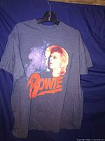 Front view showing David Bowie portrait and logo graphic
