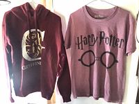 Hoodie and T-shirt hanging side by side