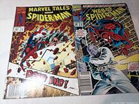 Both comic book covers side by side