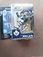 Front view of sealed Owen Nolan action figure in packaging