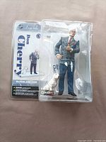 Full packaged figure, dog accessory visible