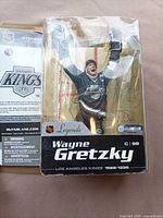 Front view of sealed Wayne Gretzky action figure in package