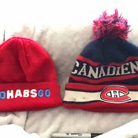 Front view of both beanies side by side