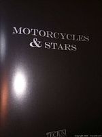 Front cover showing title Motorcycles & Stars and Tecum logo
