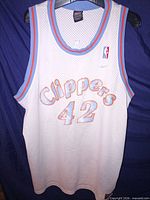 Full front view of jersey displaying team name, number, trim, and Nike swoosh