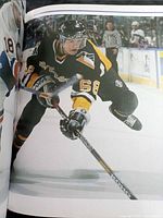 Interior action photo of Pittsburgh Penguins player #68 skating