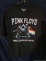 Front of black Pink Floyd Tour ’75 T-shirt showing full graphic and text