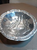 Oblique view of entire bowl showing relief design and rim text