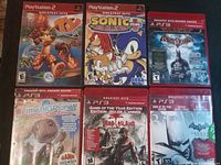 Group shot of all six red-case Greatest Hits games showing cover art