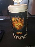 Front view showing movie poster art and overall stein design