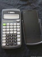 TI-30Xa calculator front view with cover beside