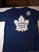 Front view of blue Toronto Maple Leafs T-shirt showing logo and 91 graphic