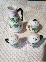 All four porcelain condiment pieces displayed together